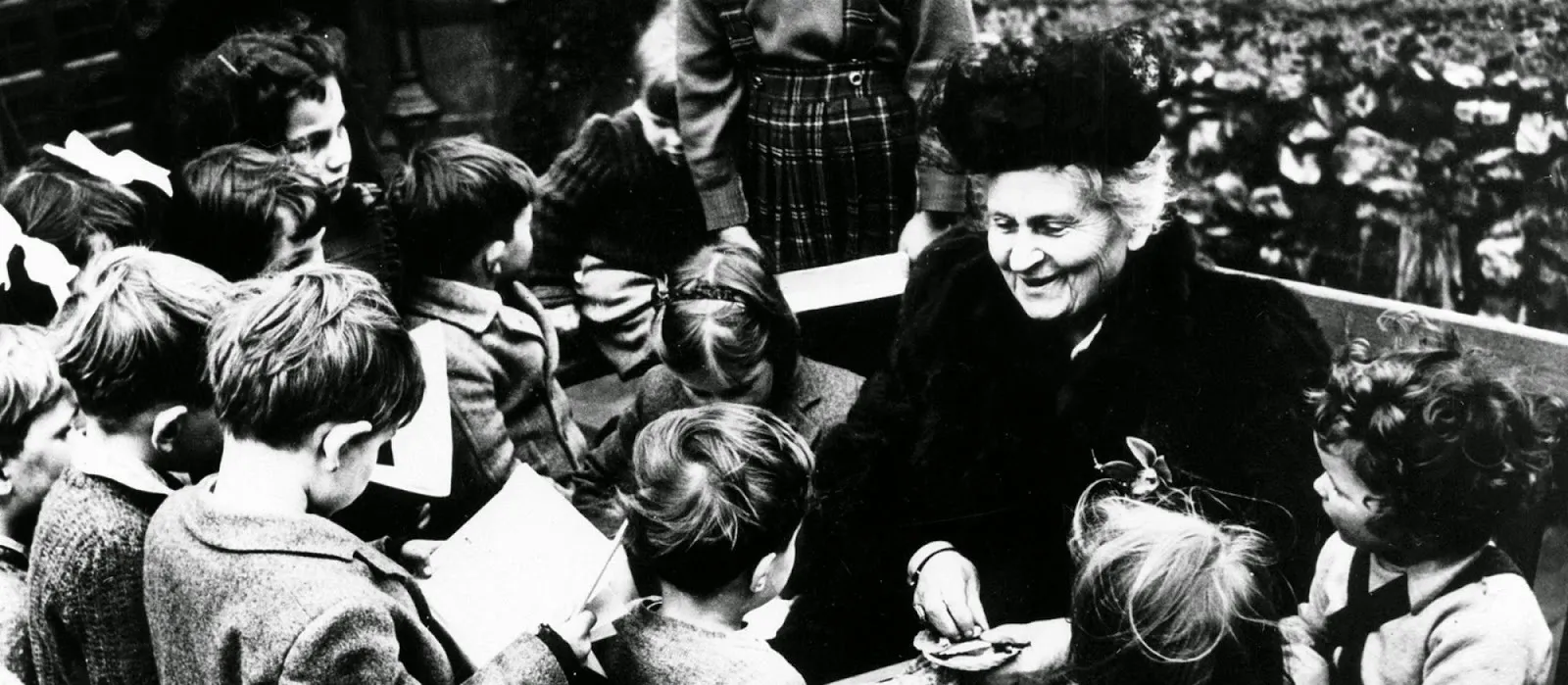 Dr. Maria Montessori with a group of children