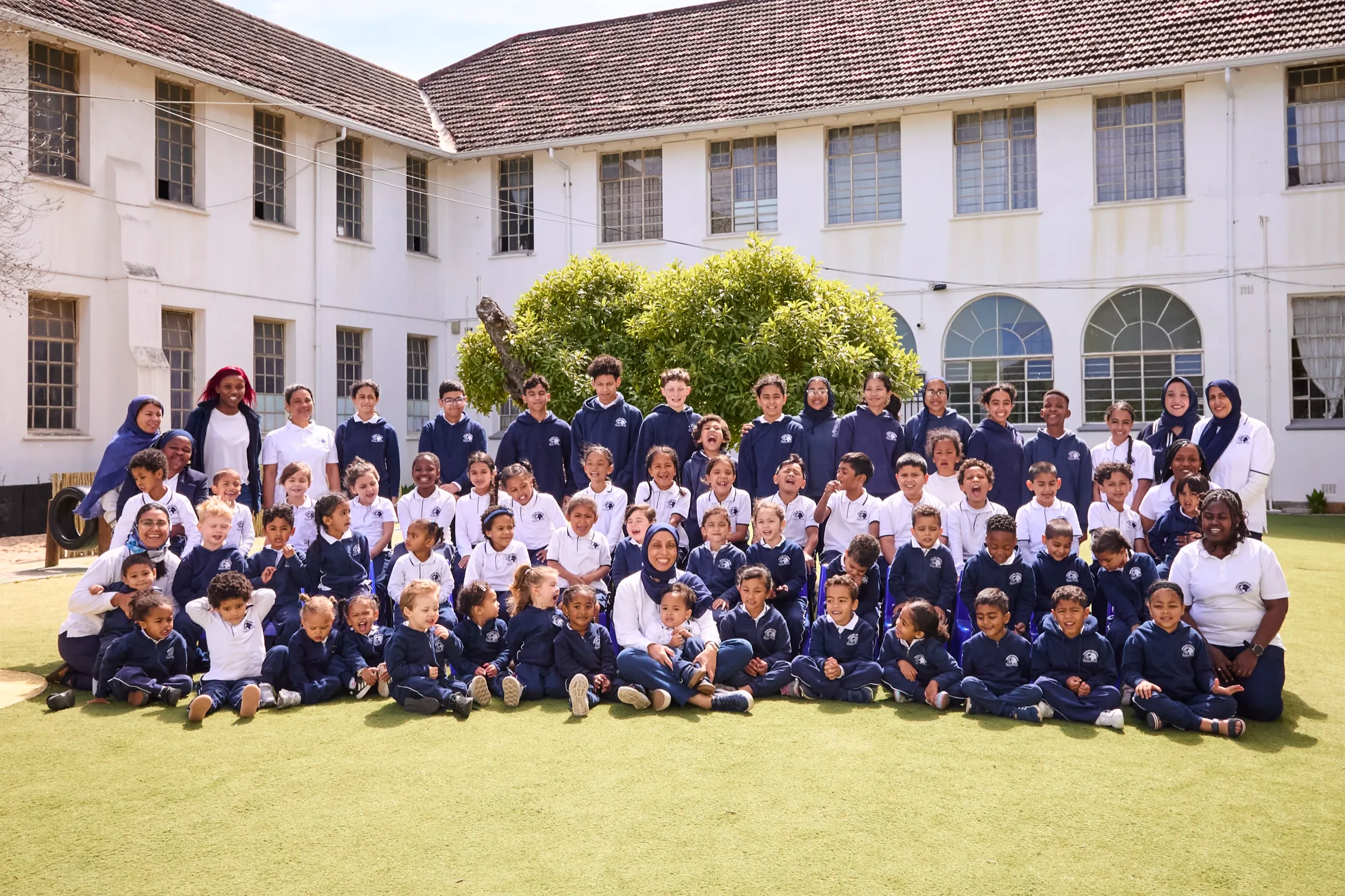 The whole Pinelands Montessori school family on the lawn